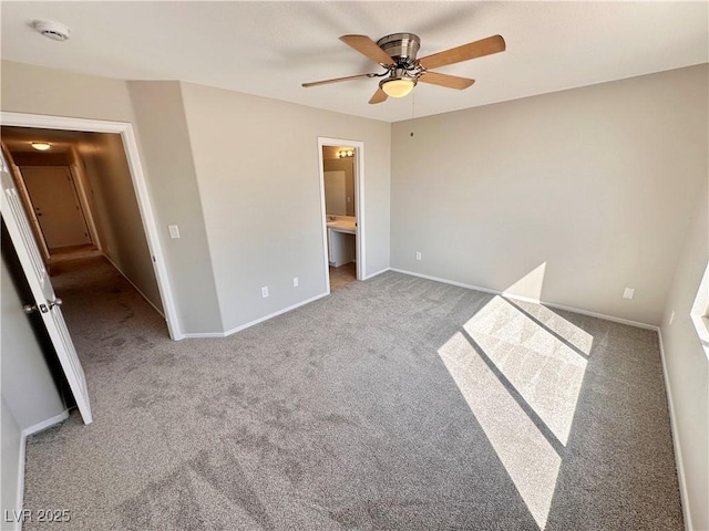 unfurnished bedroom with light carpet, ensuite bathroom, a ceiling fan, and baseboards