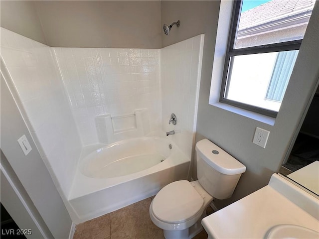 bathroom with toilet, bathtub / shower combination, vanity, and tile patterned floors