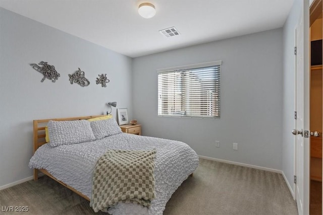 bedroom with carpet, visible vents, and baseboards