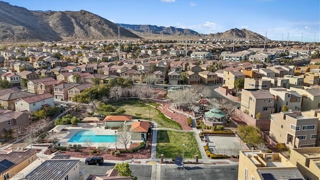 drone / aerial view featuring a residential view and a mountain view