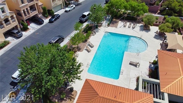 community pool featuring a patio area