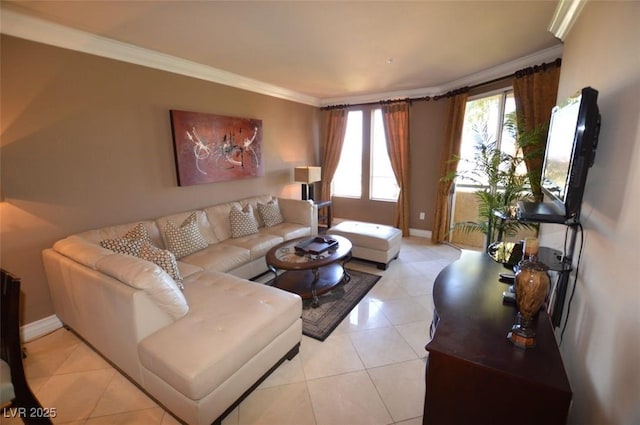 living room featuring ornamental molding, baseboards, and light tile patterned floors