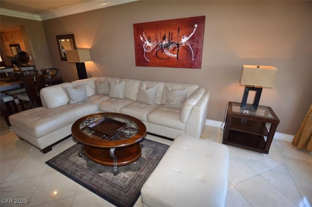 living area with light tile patterned floors, ornamental molding, and baseboards