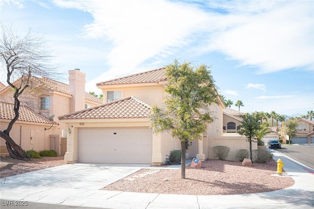 mediterranean / spanish-style home with concrete driveway, a tiled roof, an attached garage, and stucco siding