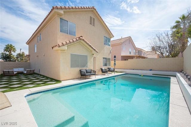 view of swimming pool featuring a fenced backyard and a fenced in pool