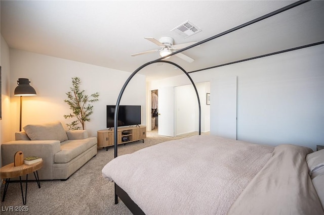 bedroom featuring visible vents, ceiling fan, and light carpet