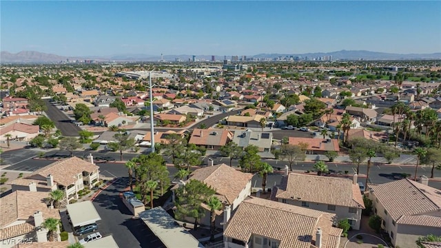 drone / aerial view featuring a residential view and a mountain view