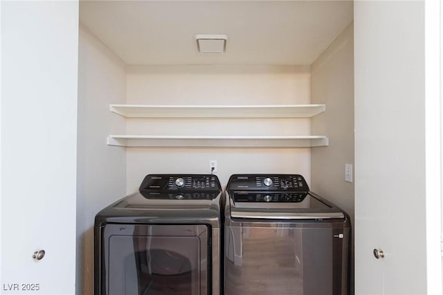 laundry area with laundry area and separate washer and dryer