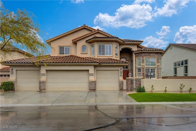 mediterranean / spanish house with stone siding, fence, concrete driveway, and stucco siding