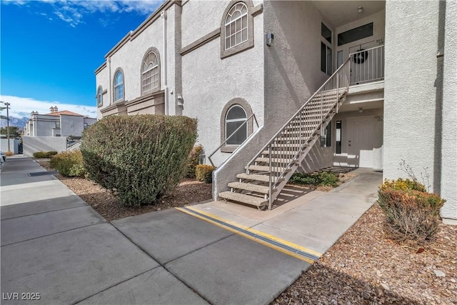 view of property with stairway