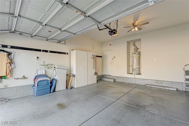 garage featuring water heater and a garage door opener