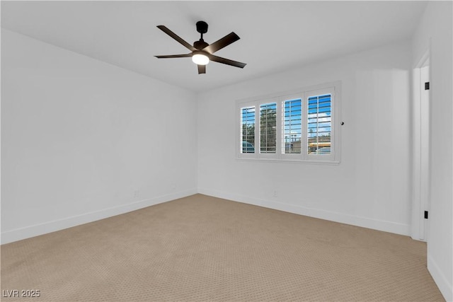 unfurnished room with light carpet, a ceiling fan, and baseboards