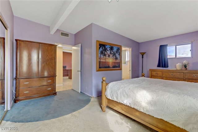 bedroom with carpet, visible vents, and vaulted ceiling with beams