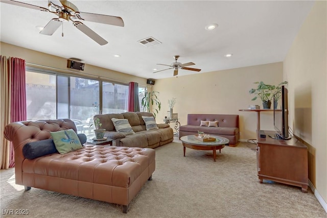 living area featuring recessed lighting, ceiling fan, visible vents, light carpet, and baseboards