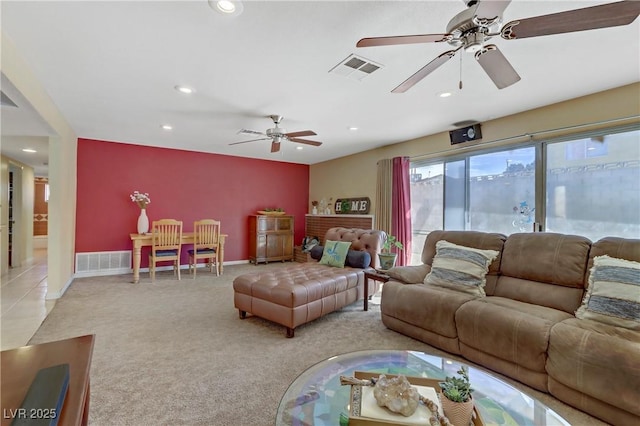 carpeted living area with visible vents, a ceiling fan, and recessed lighting