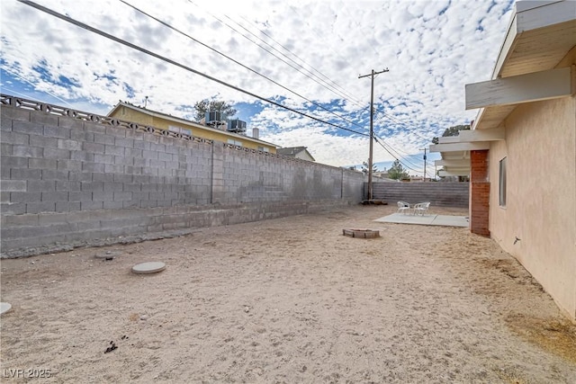 view of yard with a patio and a fenced backyard