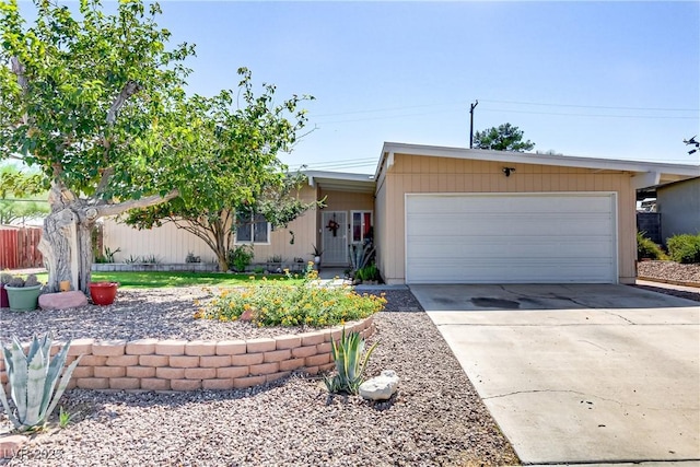 single story home featuring a garage and driveway