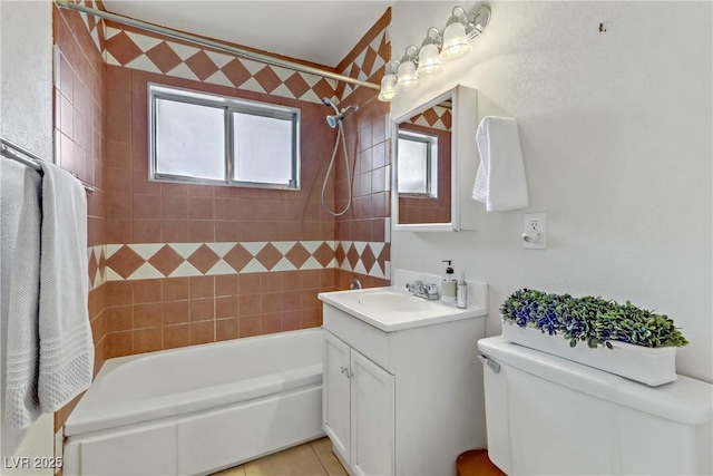 bathroom with toilet, tile patterned flooring, bathtub / shower combination, and vanity