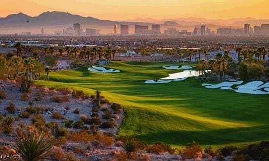 view of community with a view of city, golf course view, and a mountain view