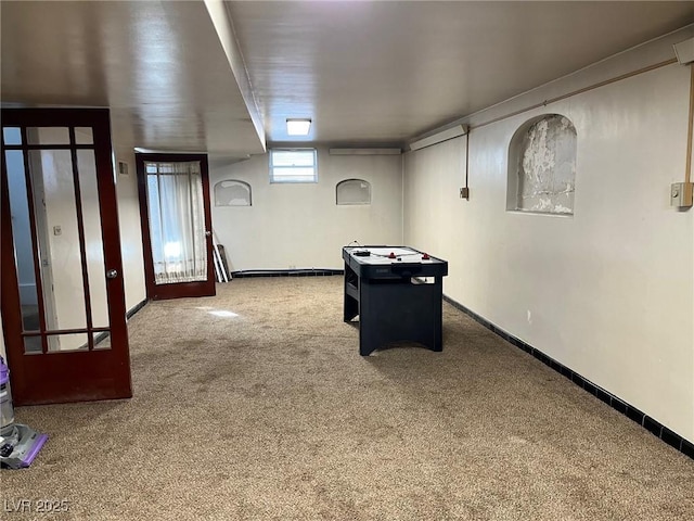 recreation room with baseboards, carpet flooring, and french doors