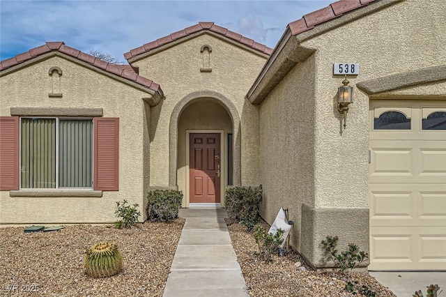 538 Cypress Gardens Pl, Henderson, NV 89012 - entrance to property with a tiled roof, an attached garage, and stucco siding