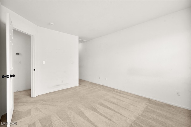 spare room with light colored carpet