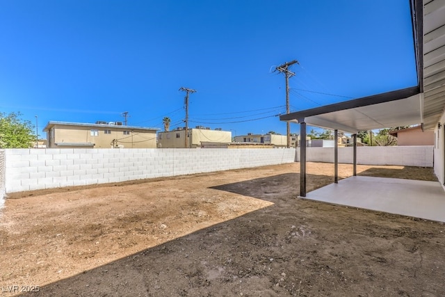 view of yard featuring a patio area and a fenced backyard