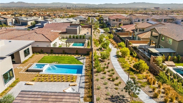 view of pool featuring a residential view and a mountain view