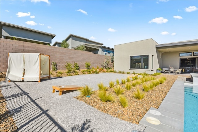 view of yard featuring a patio area and fence