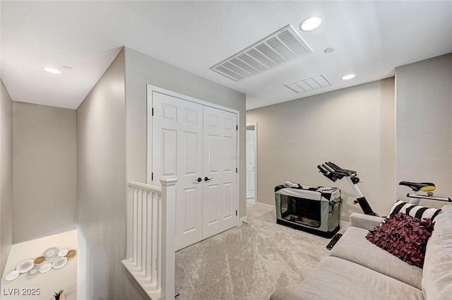 interior space with recessed lighting, visible vents, carpet floors, and baseboards