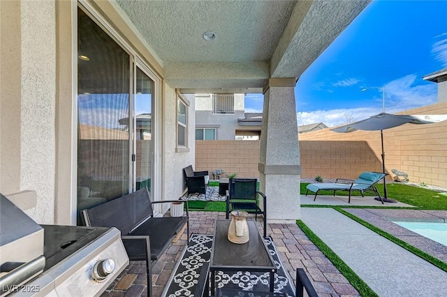 view of patio with outdoor lounge area and a fenced backyard