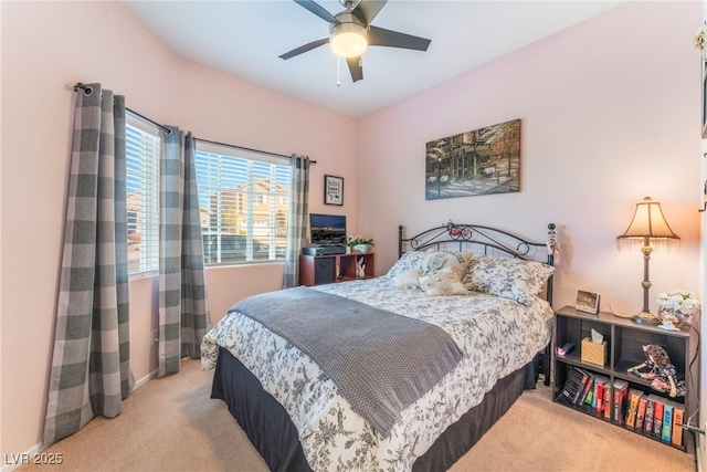 bedroom featuring light carpet and ceiling fan