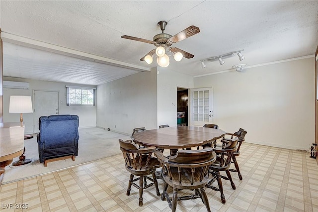 dining space with light floors, a wall mounted AC, ceiling fan, a textured ceiling, and baseboards