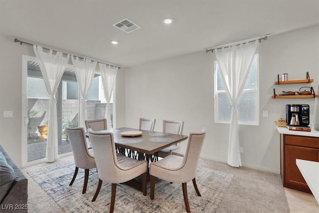 dining room featuring light carpet, baseboards, visible vents, and recessed lighting