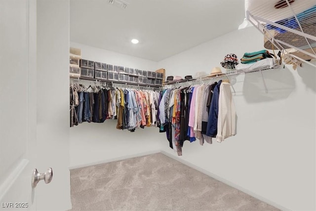 walk in closet featuring carpet