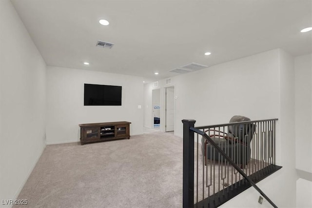 interior space with recessed lighting, visible vents, and light colored carpet