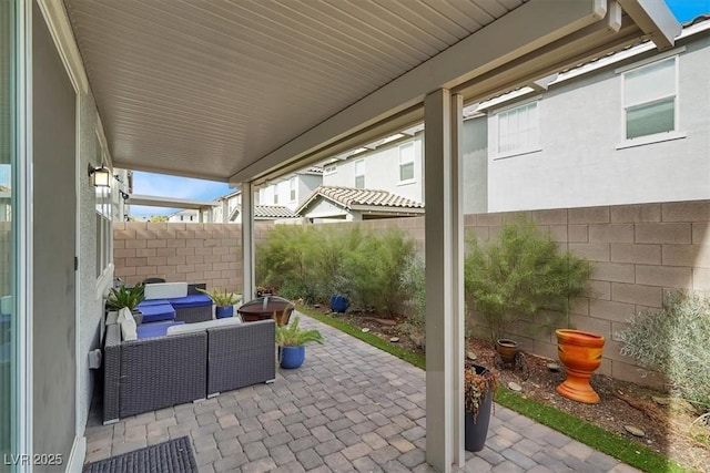 view of patio featuring a fenced backyard and an outdoor living space