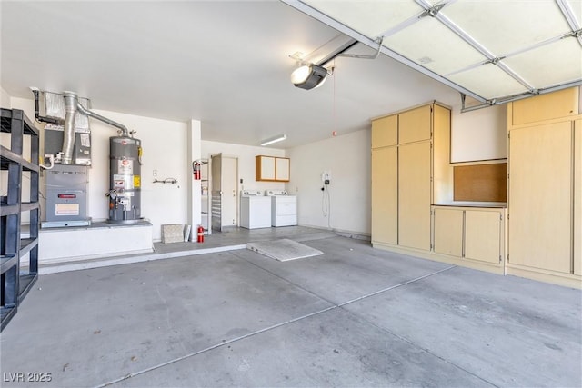 garage featuring strapped water heater, a garage door opener, and washing machine and dryer