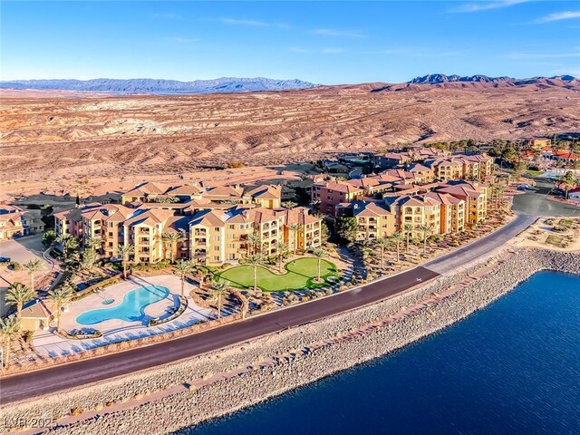 drone / aerial view with a residential view and a water and mountain view