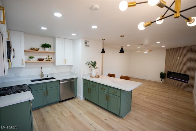 kitchen with green cabinets, white cabinetry, dishwasher, and a sink