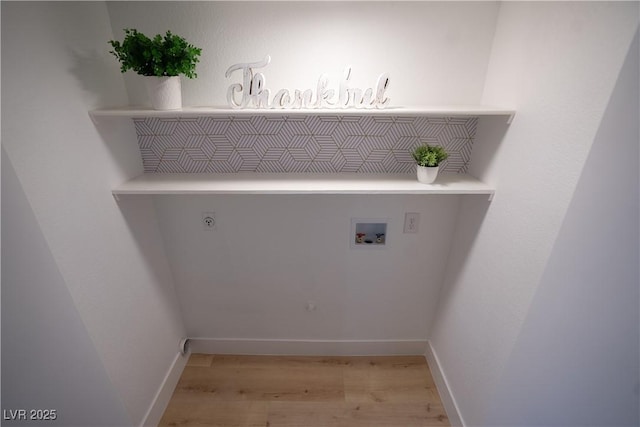 laundry area featuring laundry area, baseboards, light wood-style floors, washer hookup, and electric dryer hookup