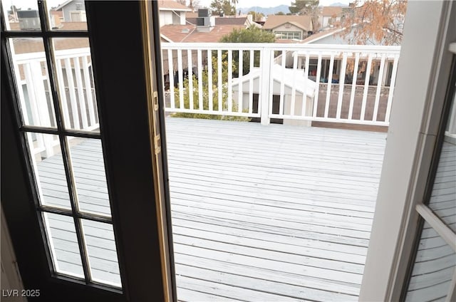 wooden deck with a residential view