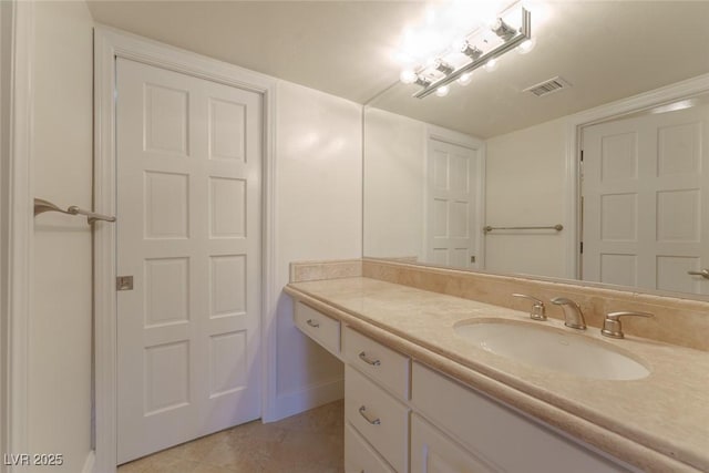 bathroom featuring visible vents, tile patterned flooring, and vanity