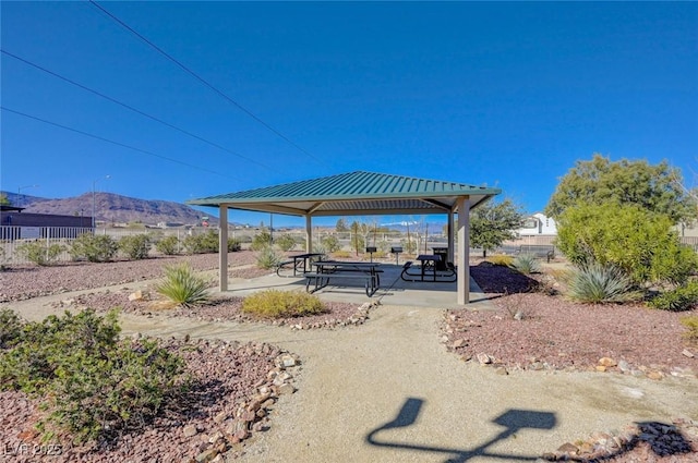 exterior space with a gazebo, a patio, fence, and a mountain view