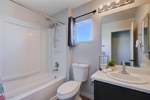 full bath with toilet, shower / tub combination, and vanity