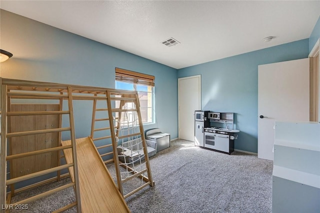 unfurnished bedroom featuring carpet floors, baseboards, and visible vents