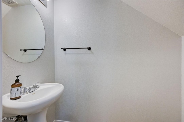 bathroom featuring a sink and visible vents