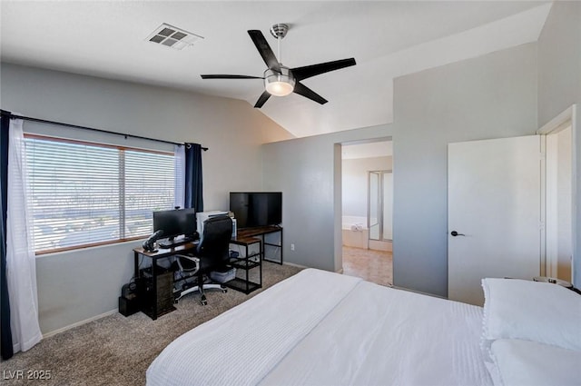 carpeted bedroom with visible vents, baseboards, ceiling fan, ensuite bathroom, and vaulted ceiling