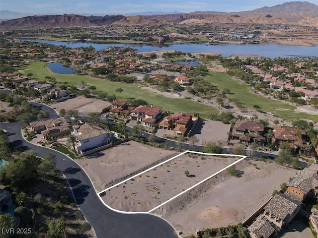 bird's eye view with a residential view and a water and mountain view