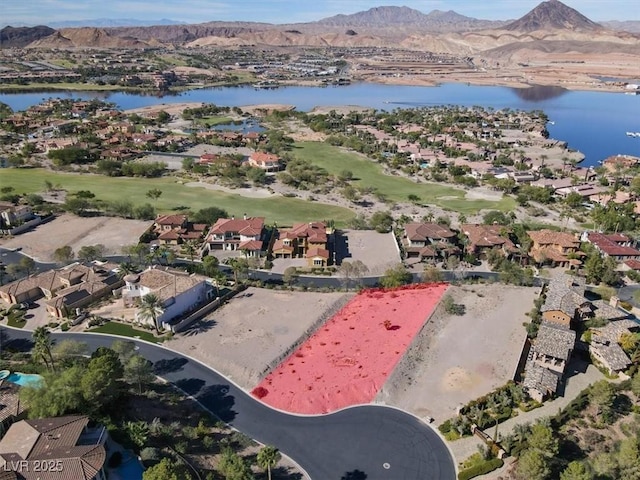 birds eye view of property with a residential view and a water and mountain view